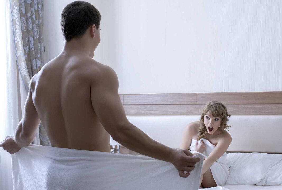 The girl is pleasantly surprised by the size of the young man's genitals